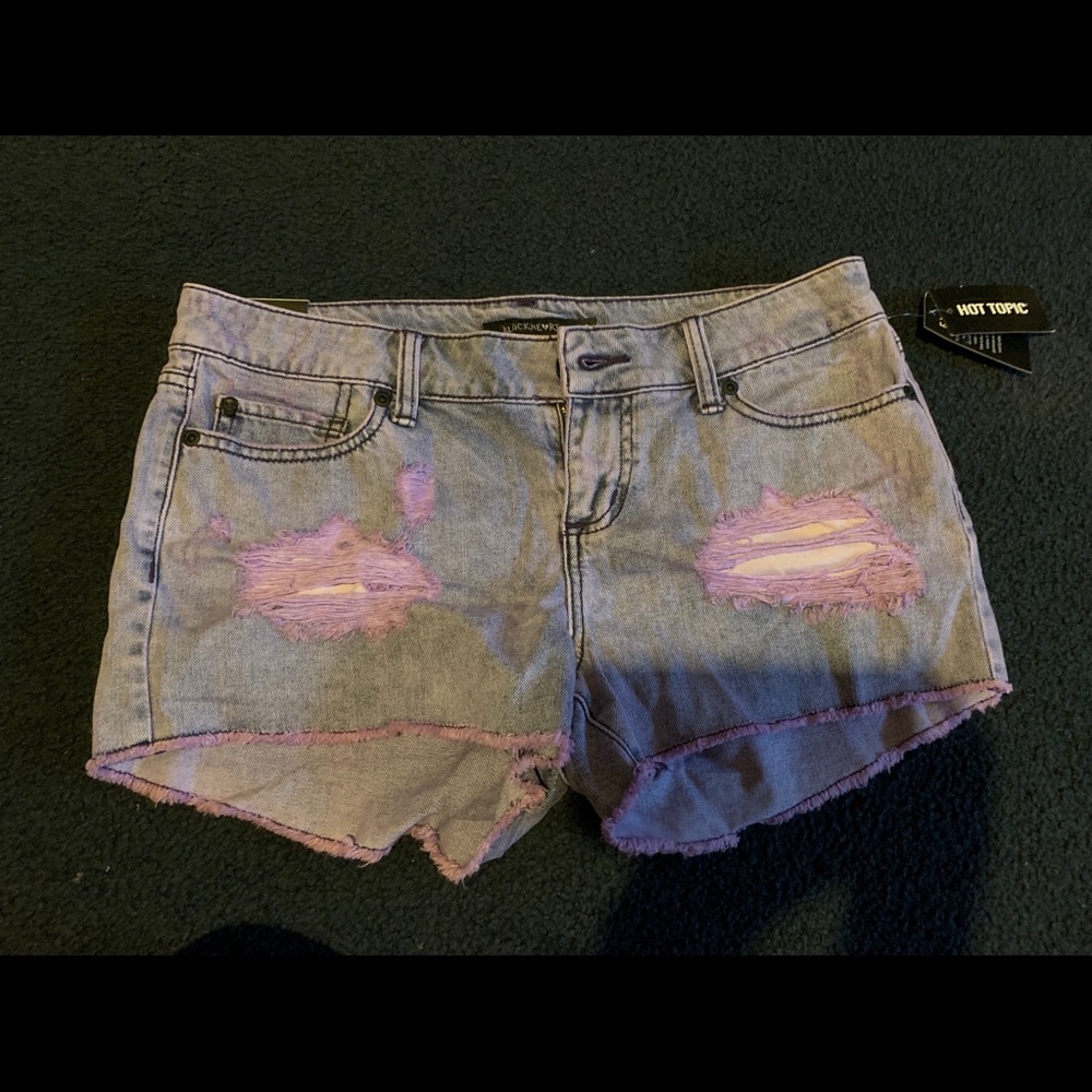 Purple ripped shorts